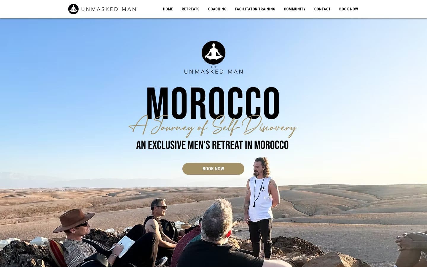 The Morocco page: a journey of self-discovery, men sitting on a desert ridge.